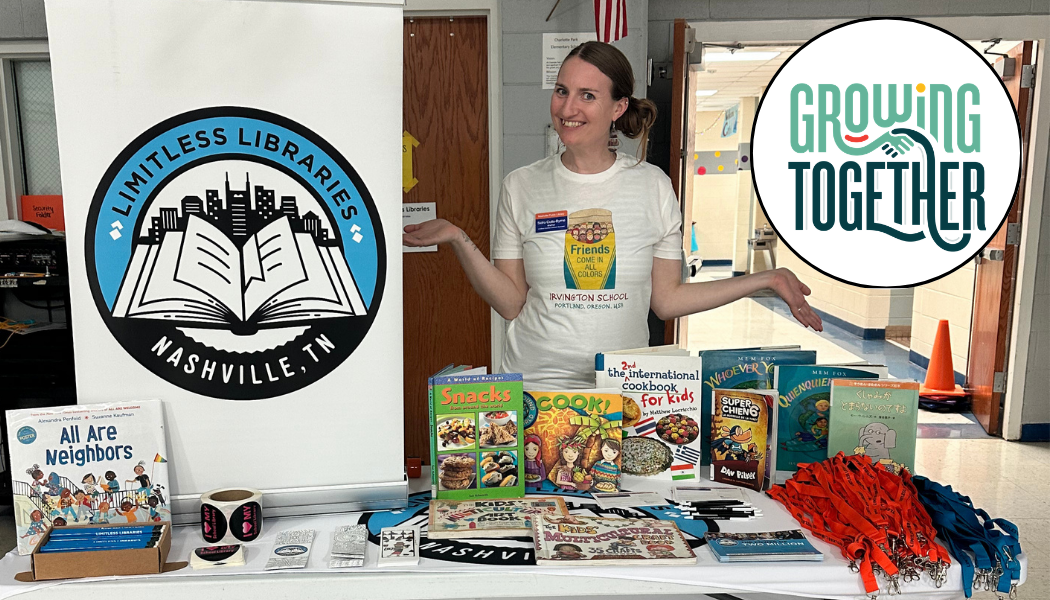 Woman posing next to Limitless Libraries sign and book display.