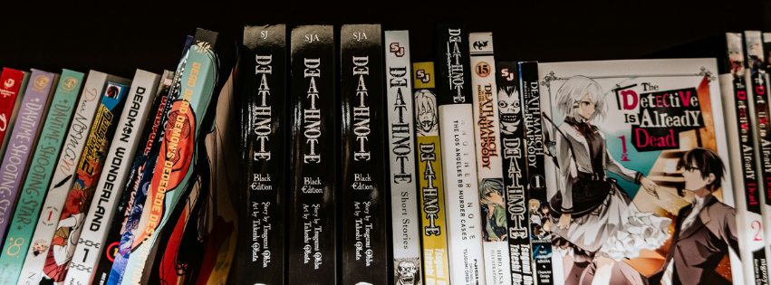 a row of manga on a shelf