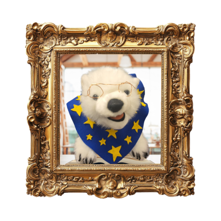 Vanilla, a polar bear, sitting on a book in a frame 