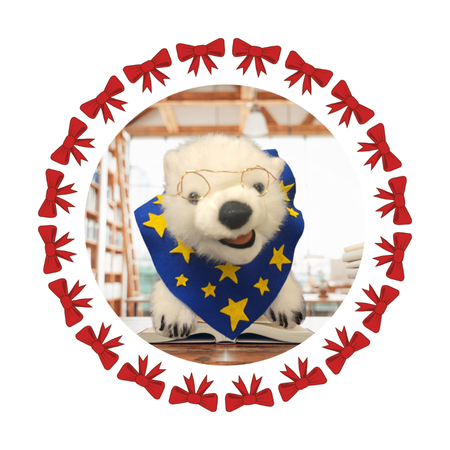 Vanilla, a polar bear, sitting on a book in a frame 