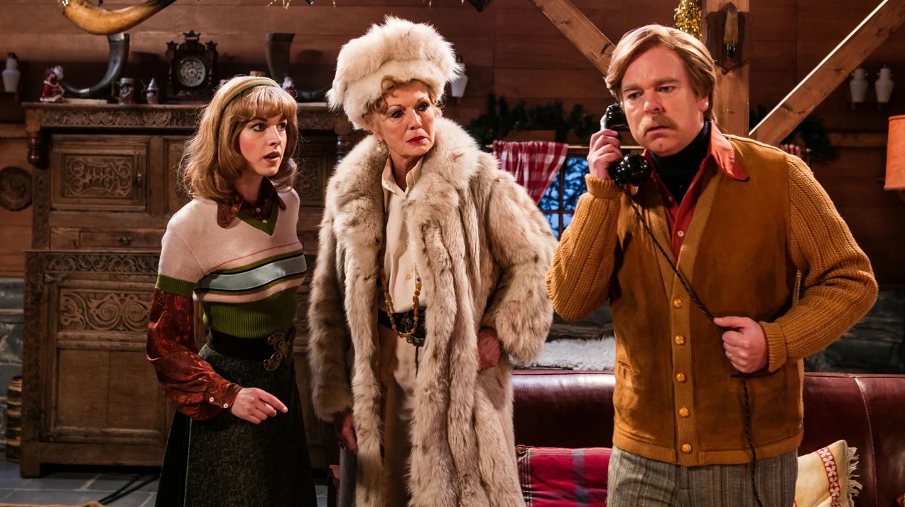 Winter cabin with a man on the phone