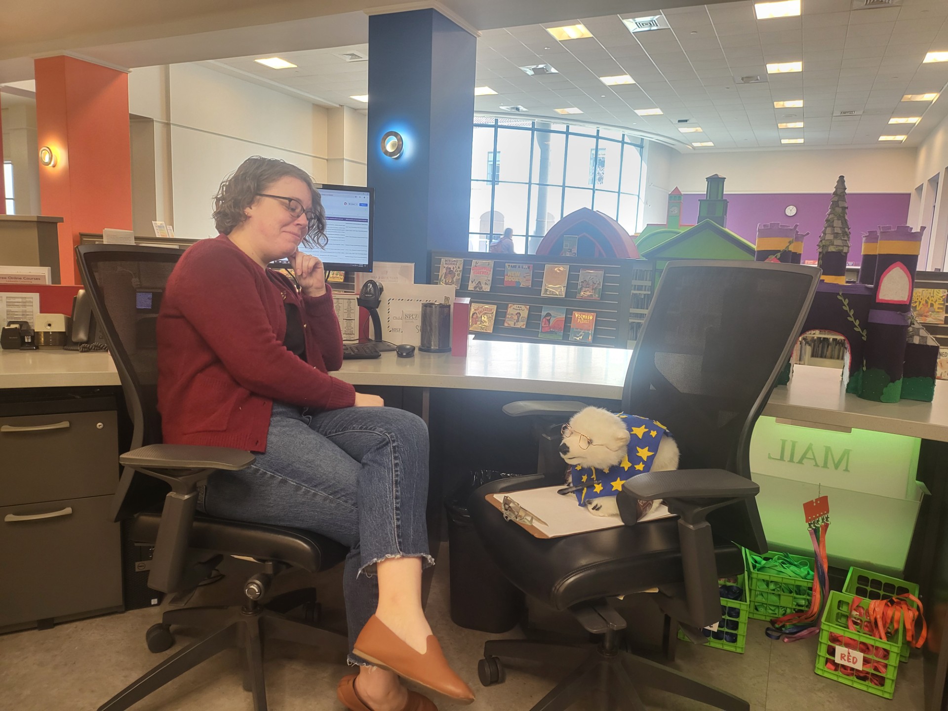 Nikki Glassley (left) and Vanilla (right) sitting across from each other. 