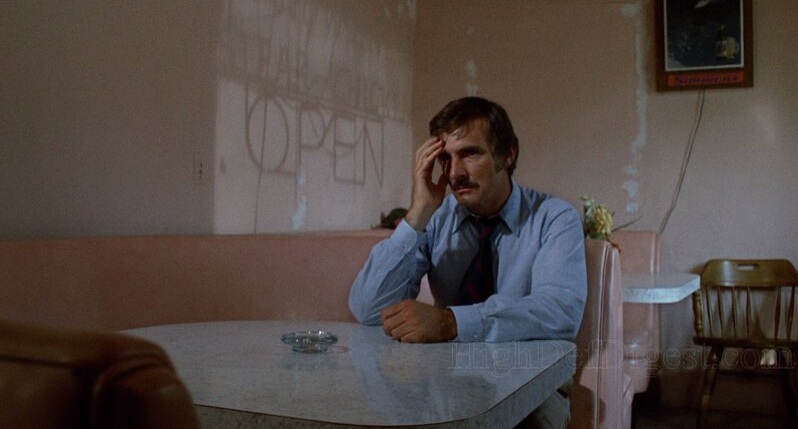 Dennis Weaver sits a spell