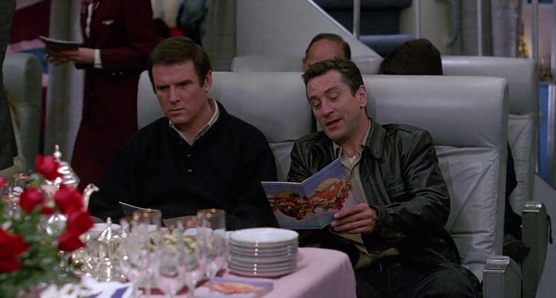 Charles Grodin and Robert De Niro aboard an airplane