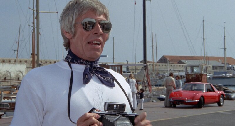 James Coburn with camera