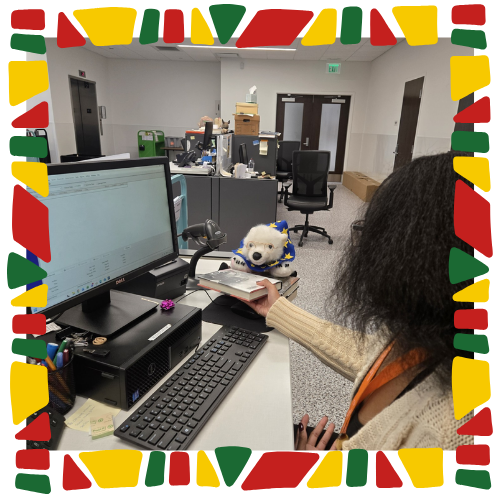 Vanilla and Destiny checking a book in.