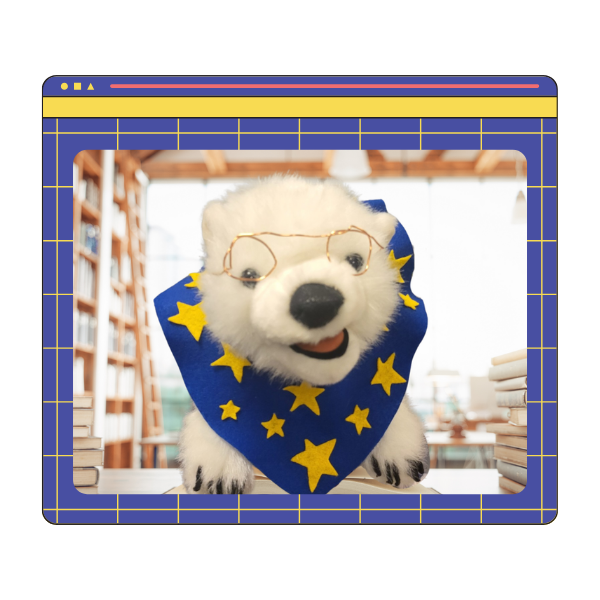 Vanilla, a polar bear, sitting on a book in a frame 
