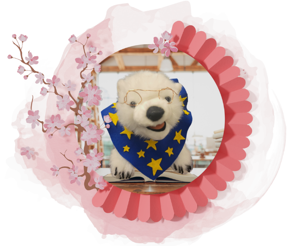 Vanilla, a polar bear, sitting on a book in a frame 