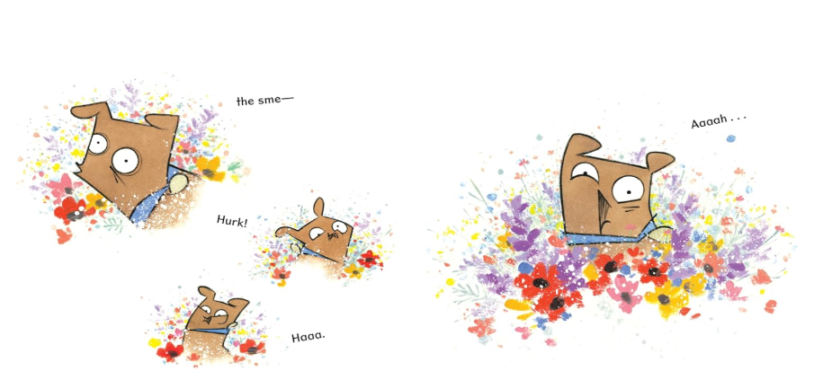 Dog smelling flowers