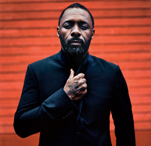 idris elba with red background
