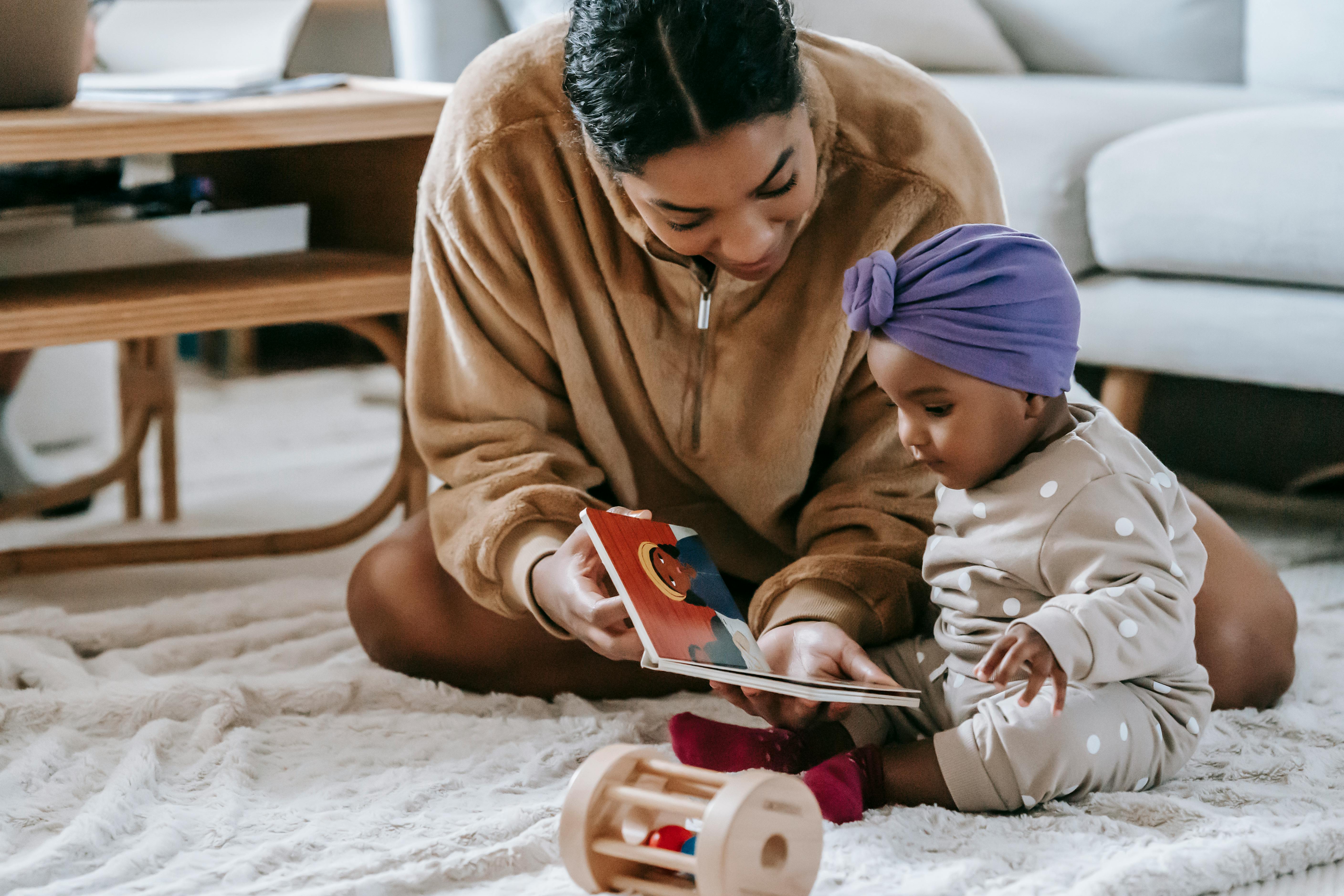 Family with baby enjoys a shared reading experience.