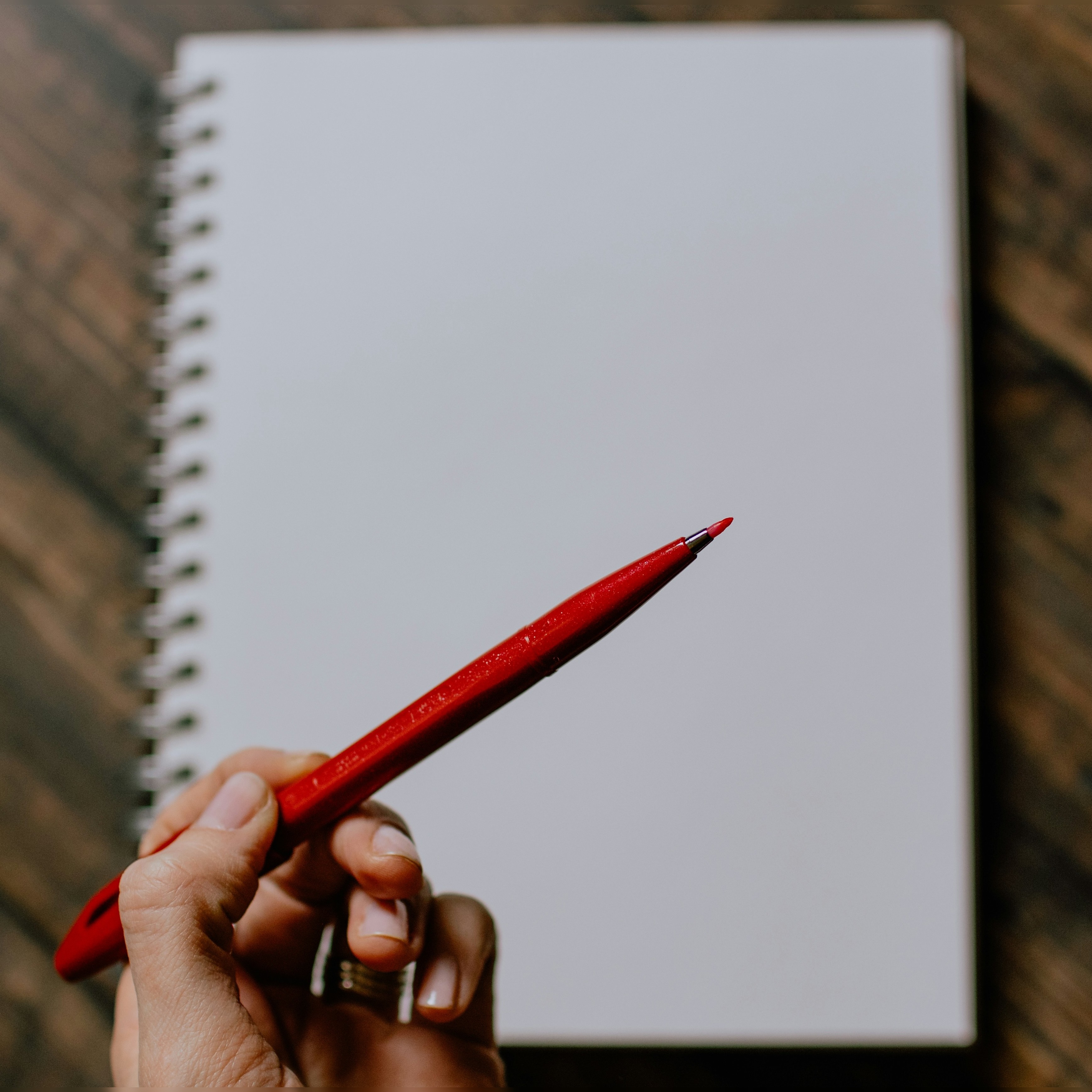 red pencil over white sheet in journal