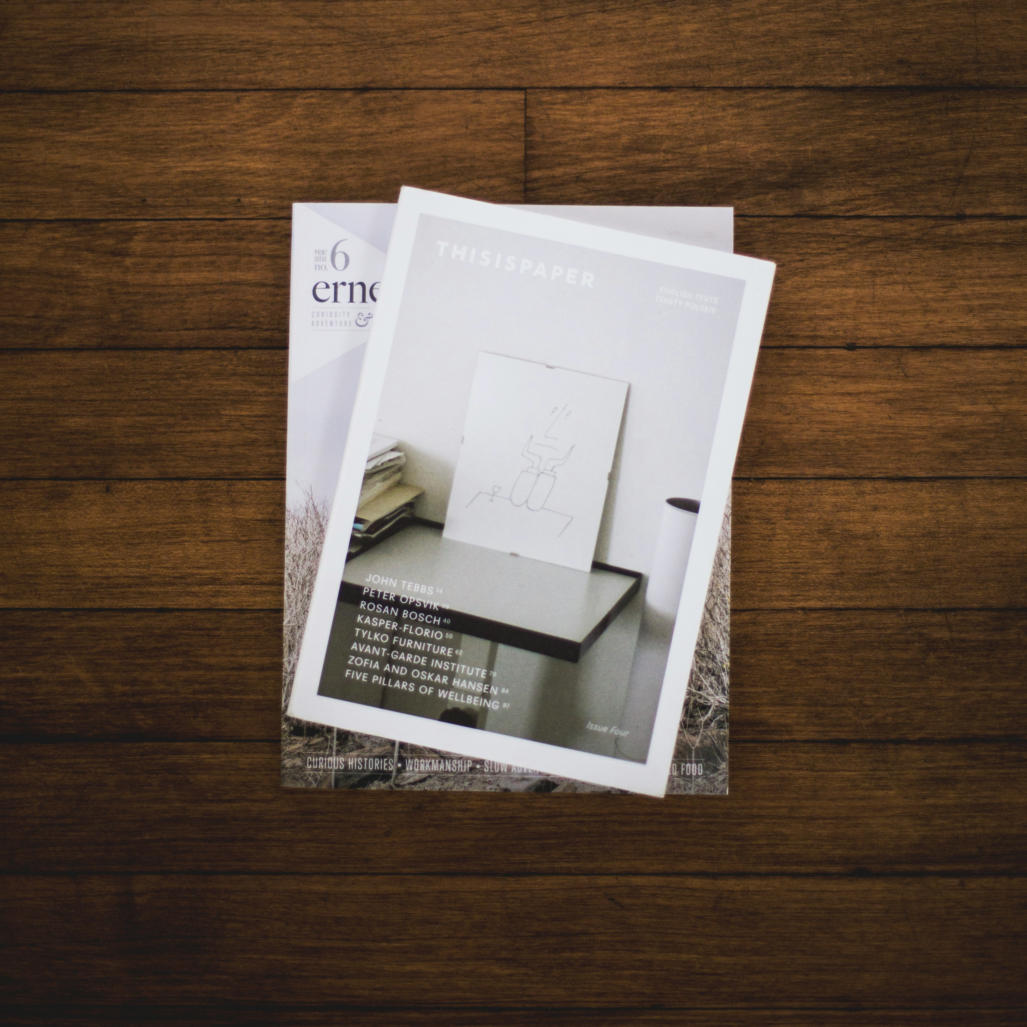 single magazine on a brown wooden table