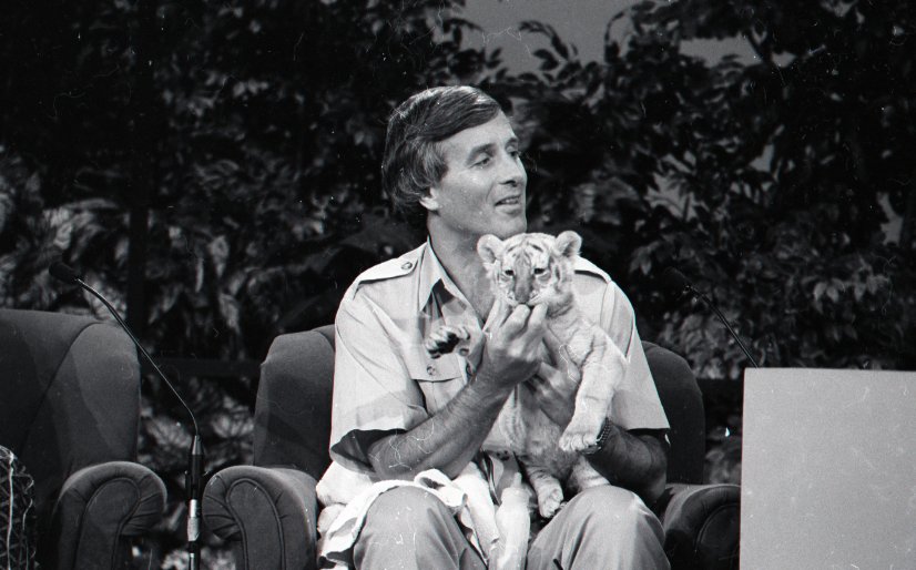 Jack Hanna holding a baby tiger cub on Nashville Now show