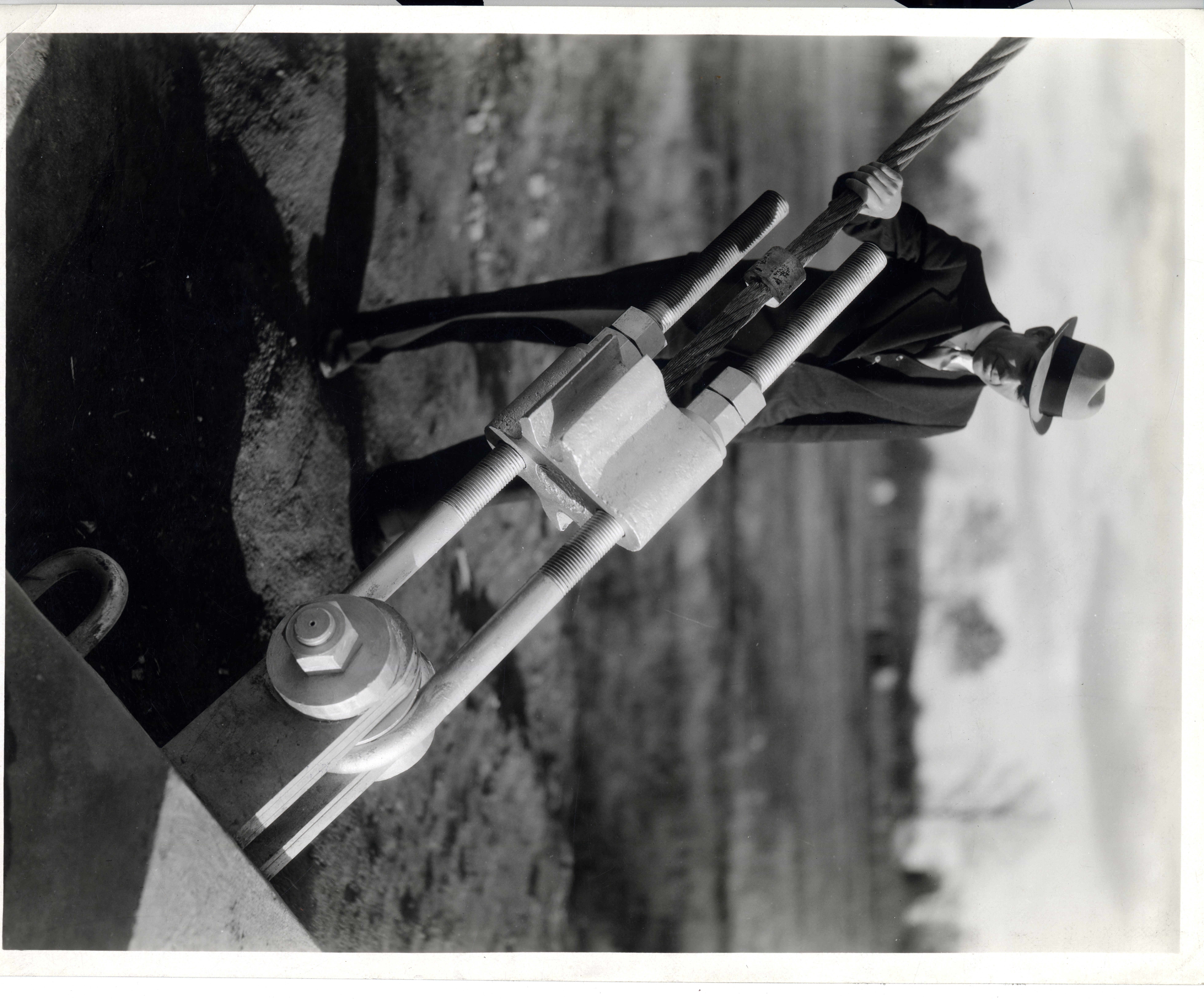 Unknown man standing with one of the cables for the WSM tower