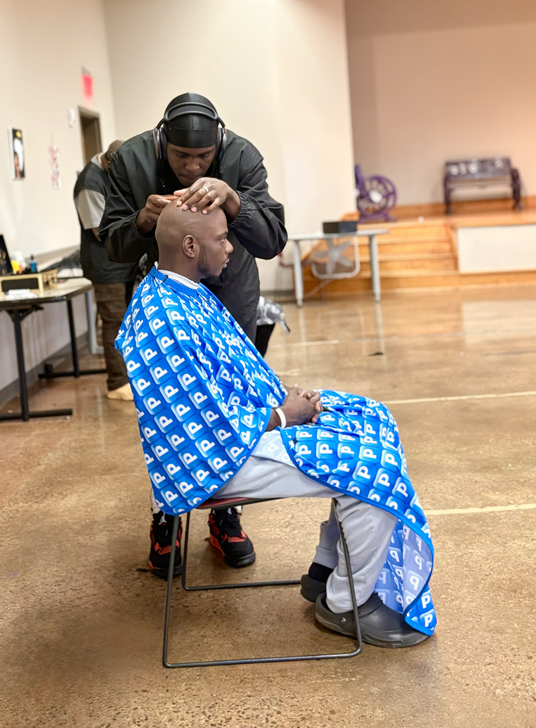 Anthony getting a free haircut and shave at Pruitt Branch Library.