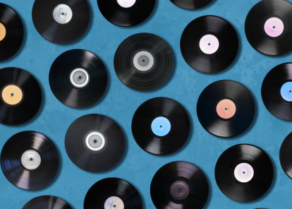 Vinyl LPs on a blue background.