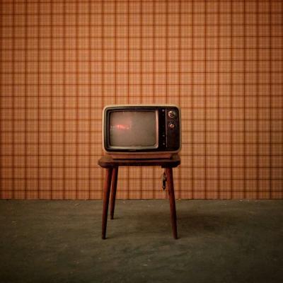 television on a stool in sepia