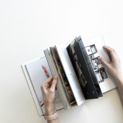 square image of a book on white desk