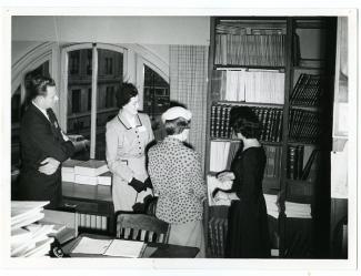 Historic Photos Collection - Photo of Library staff looking at resources, circa 1964