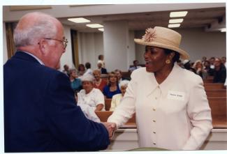 Senator Thelma Harper shaking hands with another politician