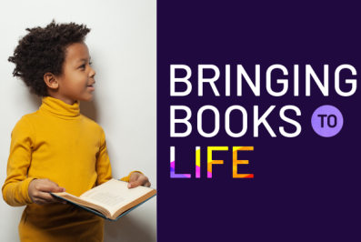 Smiling young boy with an open book. Bringing Books to Life logo on right side of image.